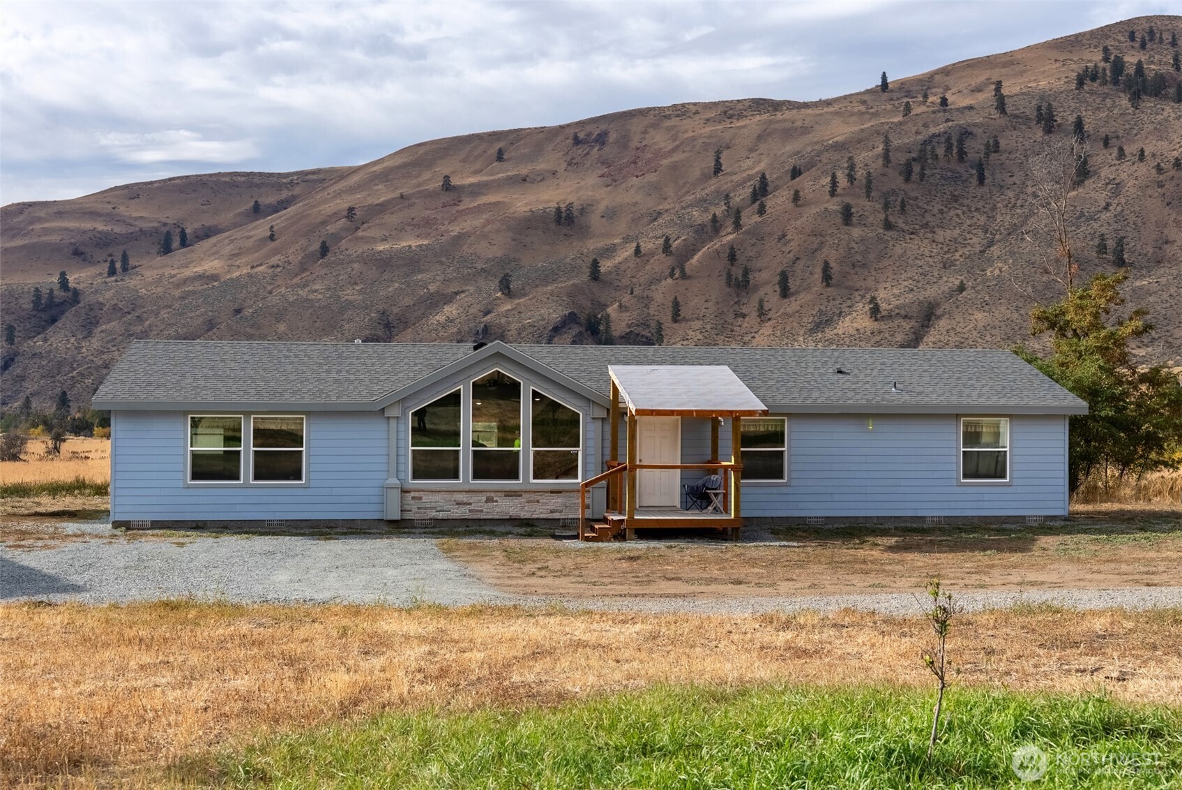 2431 Highway 153 Twisp, WA 98856 - Photo 1 of 40 front view of a house with a yard