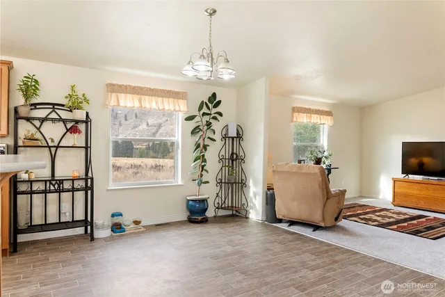 a view of livingroom with furniture window and front door