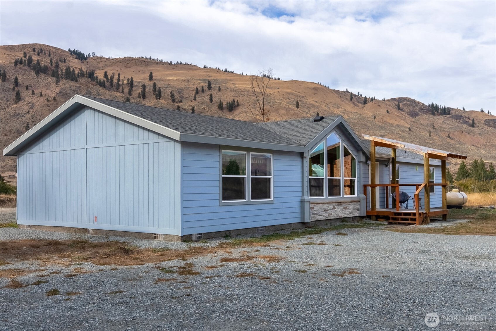 2431 Highway 153 Twisp, WA 98856 - Photo 2 of 40 a view of a house with a yard