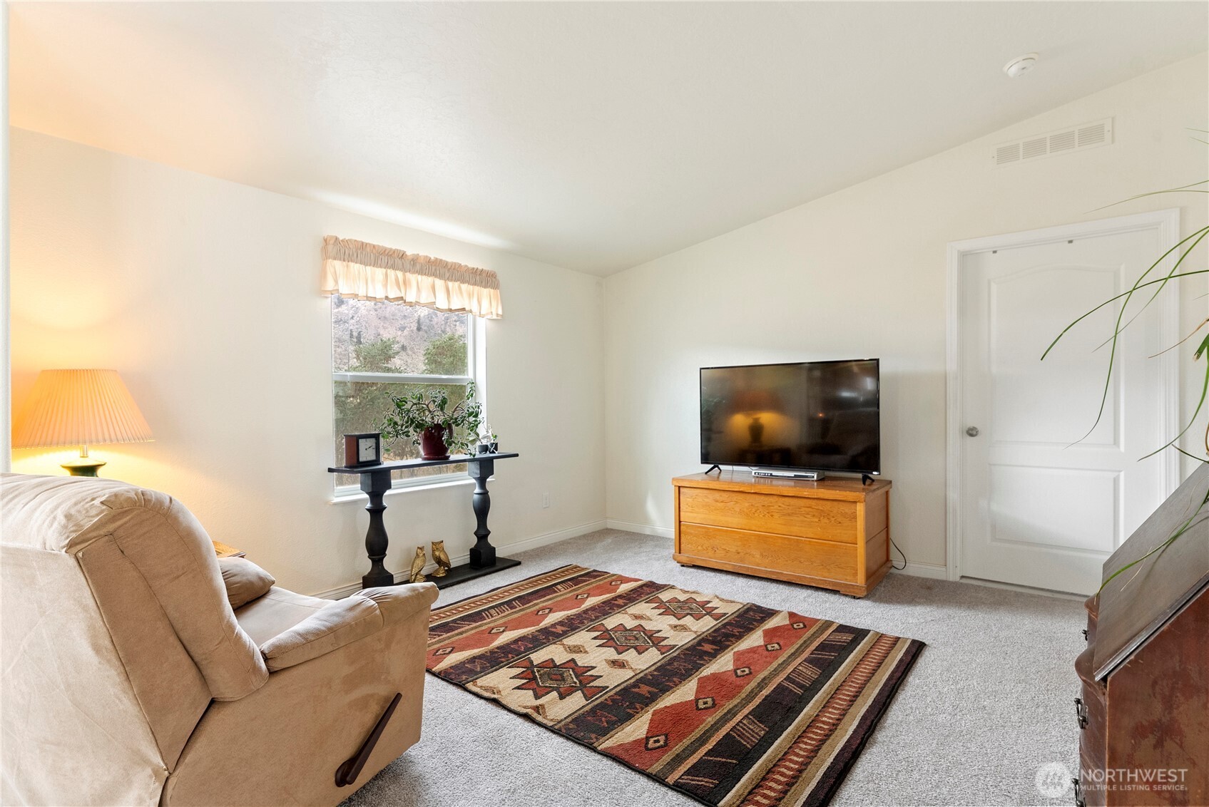 2431 Highway 153 Twisp, WA 98856 - Photo 21 of 40 a living room with furniture and a flat screen tv