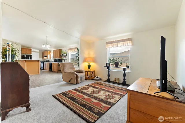 a living room with furniture rug and window