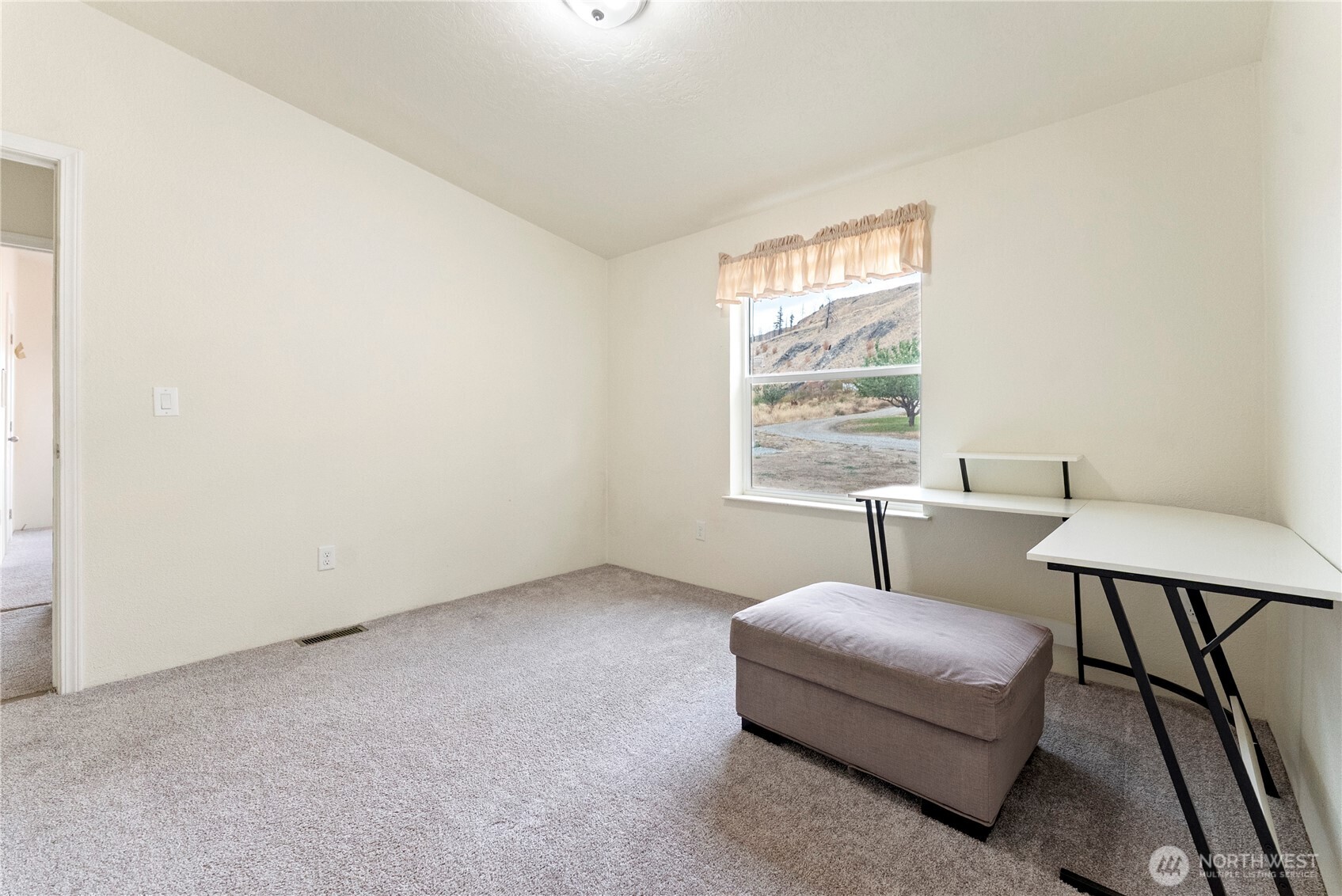 2431 Highway 153 Twisp, WA 98856 - Photo 31 of 40 a bedroom with furniture and a window