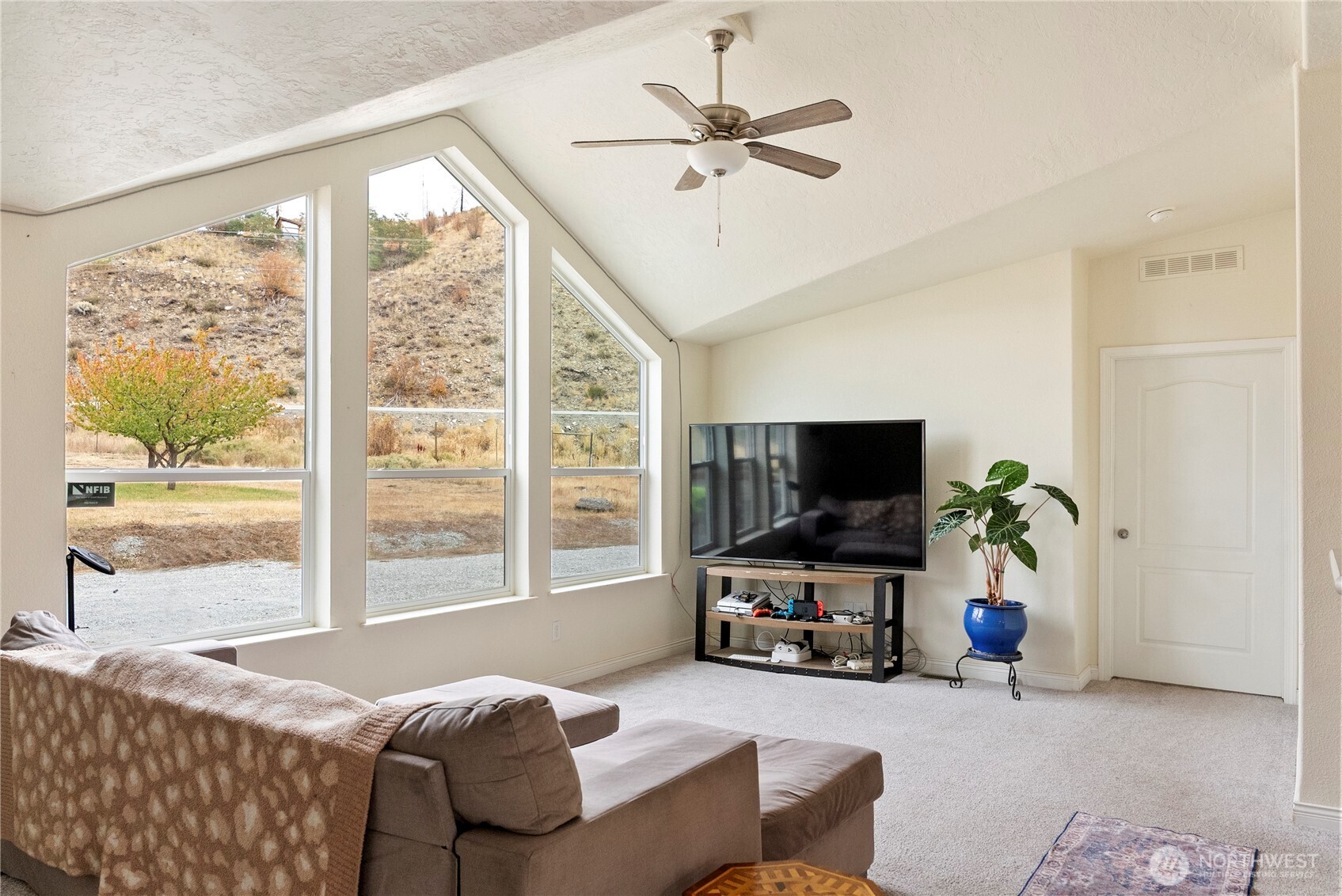 2431 Highway 153 Twisp, WA 98856 - Photo 4 of 40 a living room with furniture and a flat screen tv