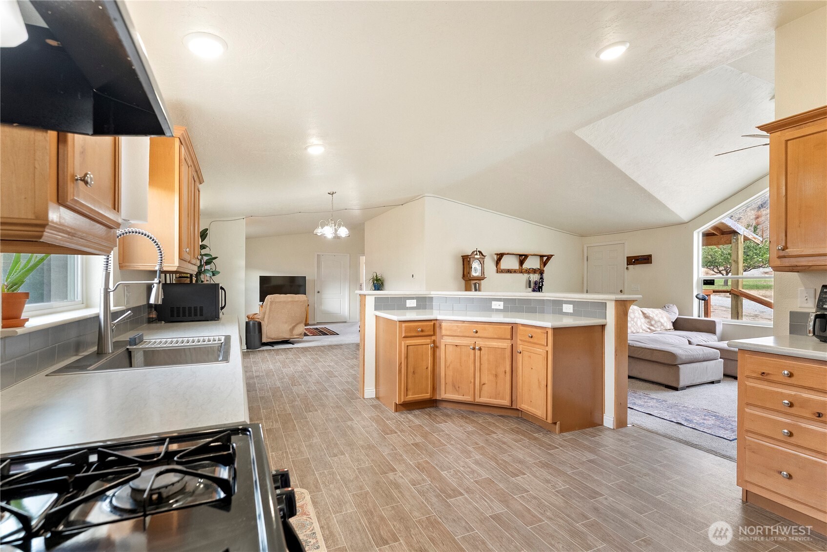 2431 Highway 153 Twisp, WA 98856 - Photo 10 of 40 a kitchen with sink a stove and cabinets