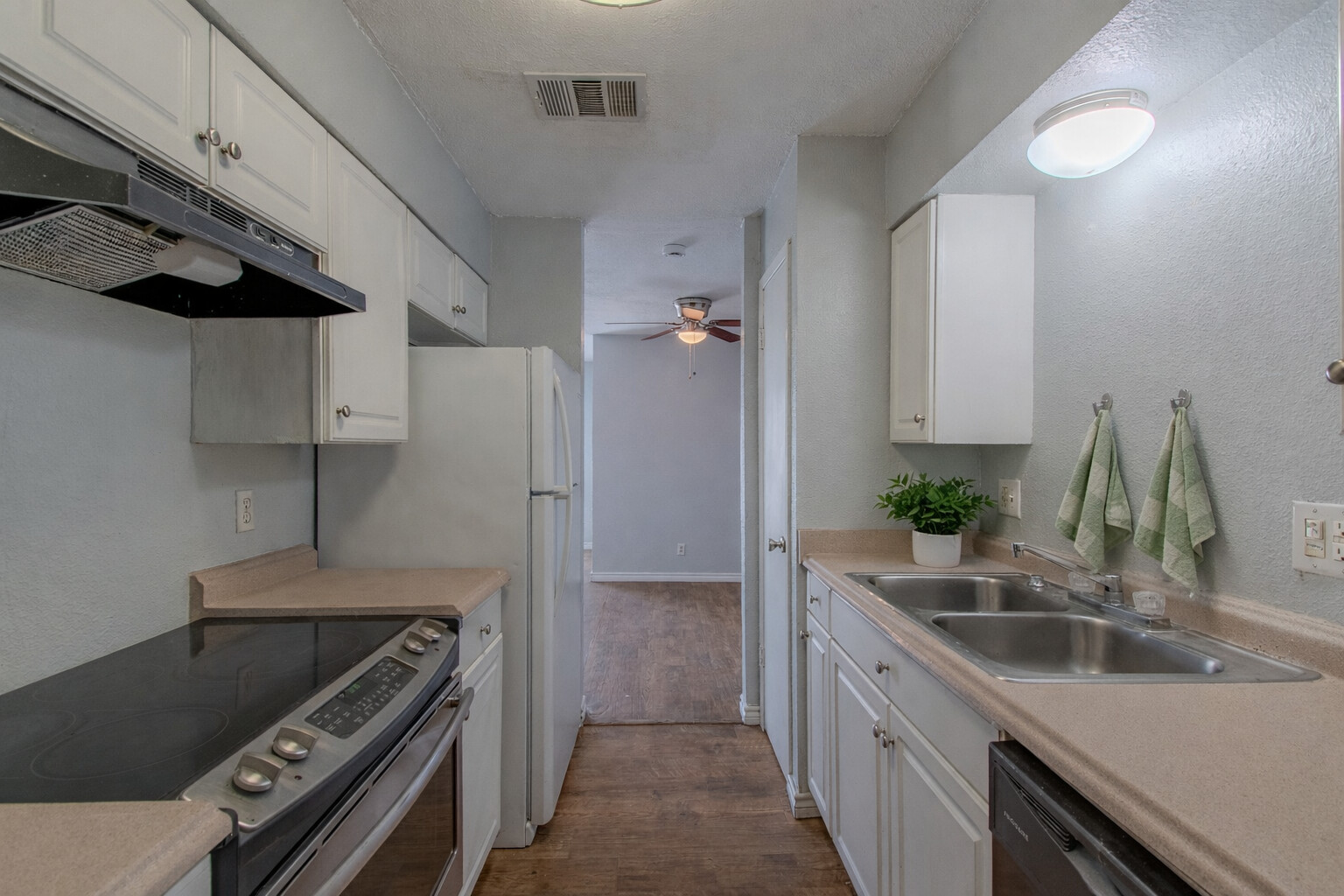 100 Uhland Road, Unit 3 San Marcos, TX 78666 - Photo 11 of 26 a kitchen that has a sink and a stove