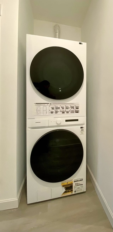 18 Howard Street, Unit 1 Waltham, MA 02451 - Photo 12 of 12 a utility room with dryer and washer