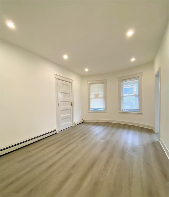 18 Howard Street, Unit 1 Waltham, MA 02451 - Photo 3 of 12 a view of an empty room with a window