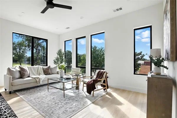 a living room with furniture and a large window