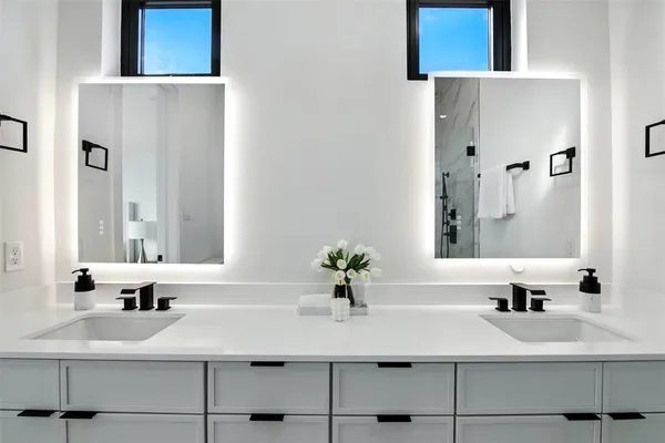 a bathroom with a sink and a mirror