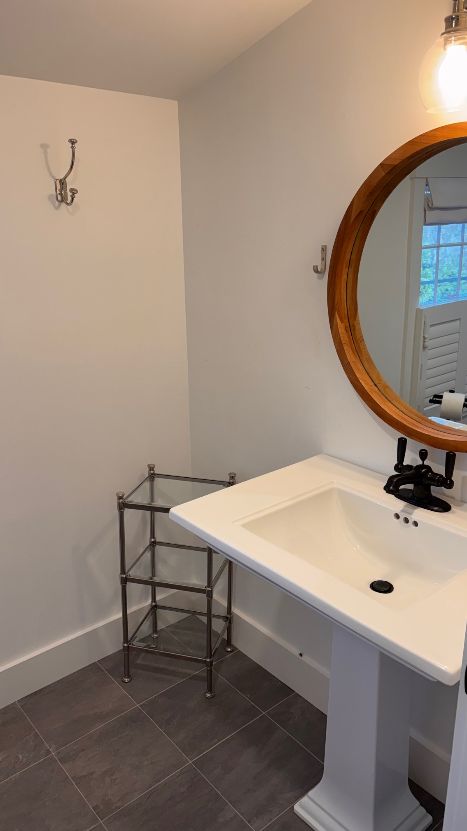 31 North Street Edgartown, MA 02539 - Photo 47 of 49 a bathroom with a sink and a mirror