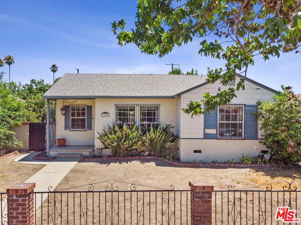 front view of a house with a garden