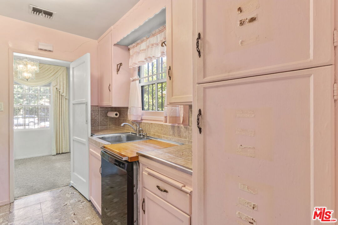 6900 Corbin Avenue Reseda, CA 91335 - Photo 14 of 35 a kitchen with a sink and a refrigerator