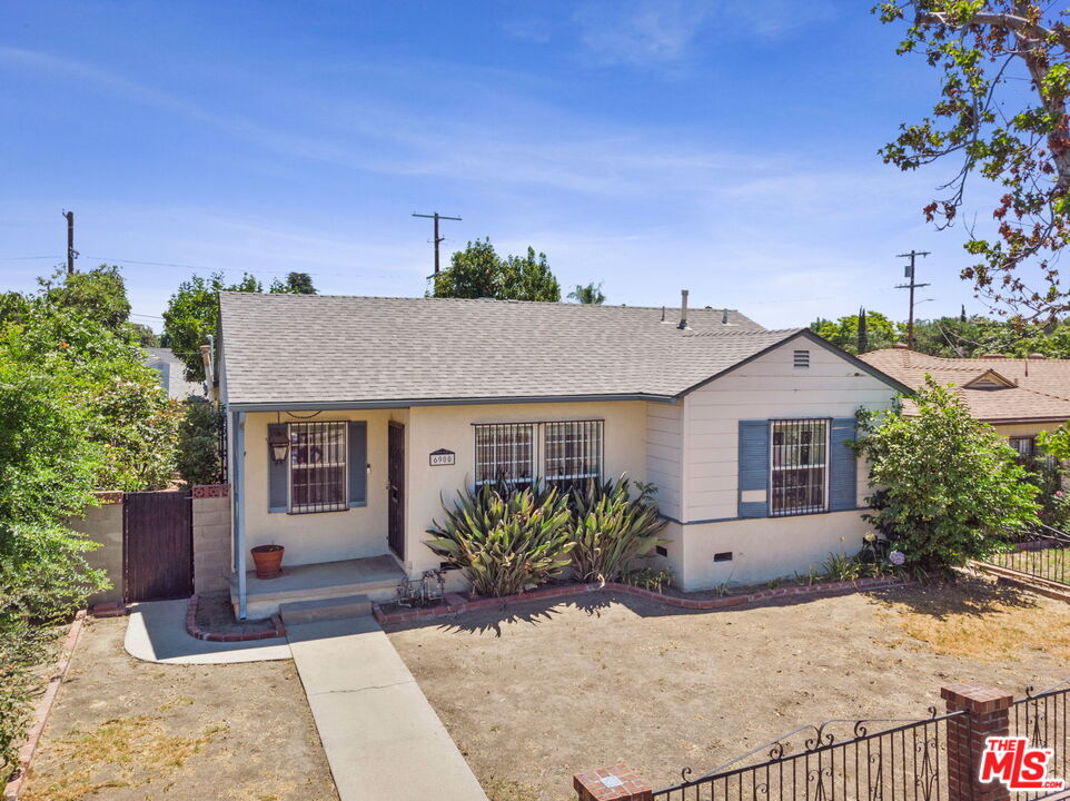 6900 Corbin Avenue Reseda, CA 91335 - Photo 2 of 35 a view of a house with a yard and potted plants