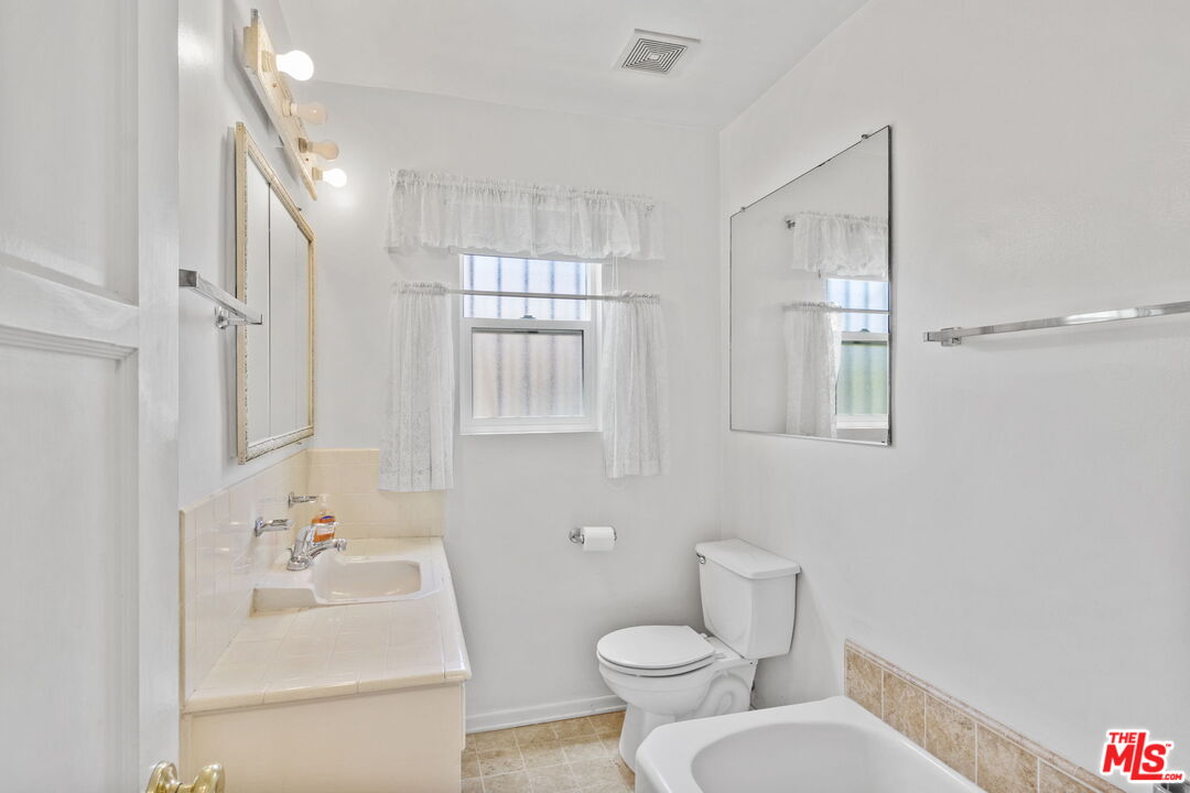 6900 Corbin Avenue Reseda, CA 91335 - Photo 22 of 35 a bathroom with a sink toilet and shower