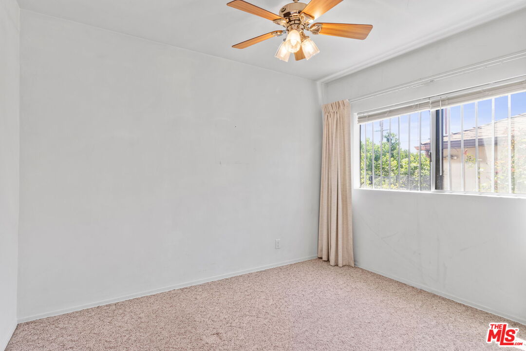 6900 Corbin Avenue Reseda, CA 91335 - Photo 24 of 35 an empty room with windows and fan