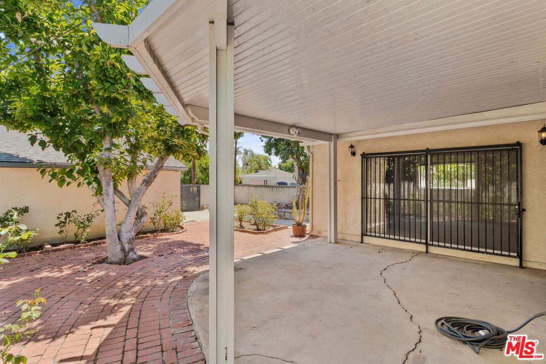6900 Corbin Avenue Reseda, CA 91335 - Photo 25 of 35 a view of a porch with furniture and floor to ceiling window