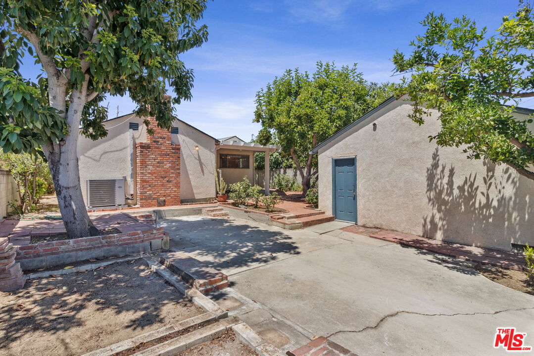6900 Corbin Avenue Reseda, CA 91335 - Photo 28 of 35 a view of a house with a yard and tree