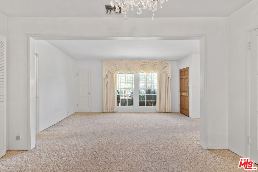 6900 Corbin Avenue Reseda, CA 91335 - Photo 6 of 35 a view of an empty room with a window