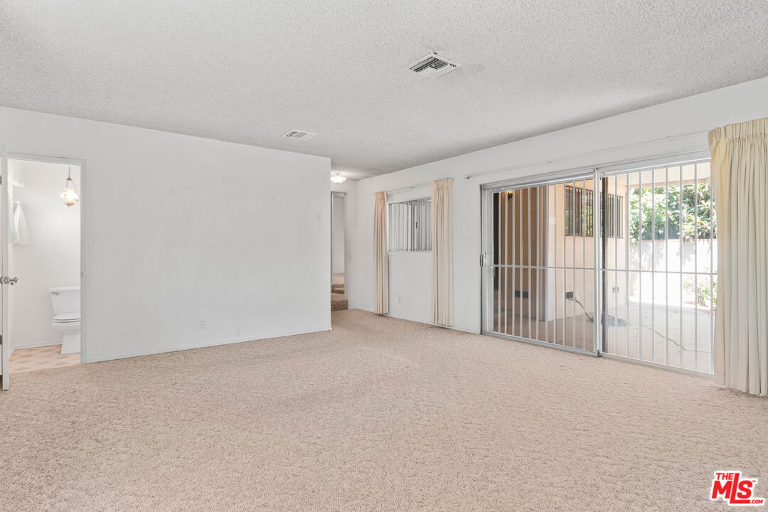 6900 Corbin Avenue Reseda, CA 91335 - Photo 8 of 35 a view of an empty room with a window