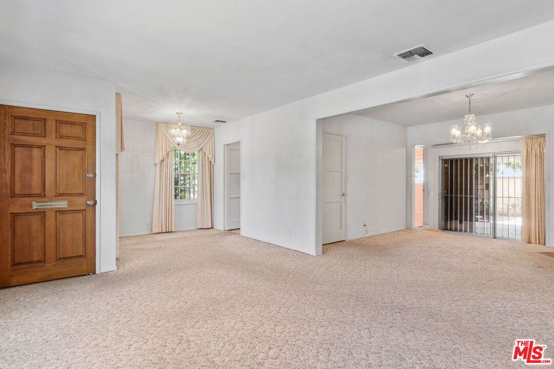 6900 Corbin Avenue Reseda, CA 91335 - Photo 9 of 35 a view of an empty room with closet and windows