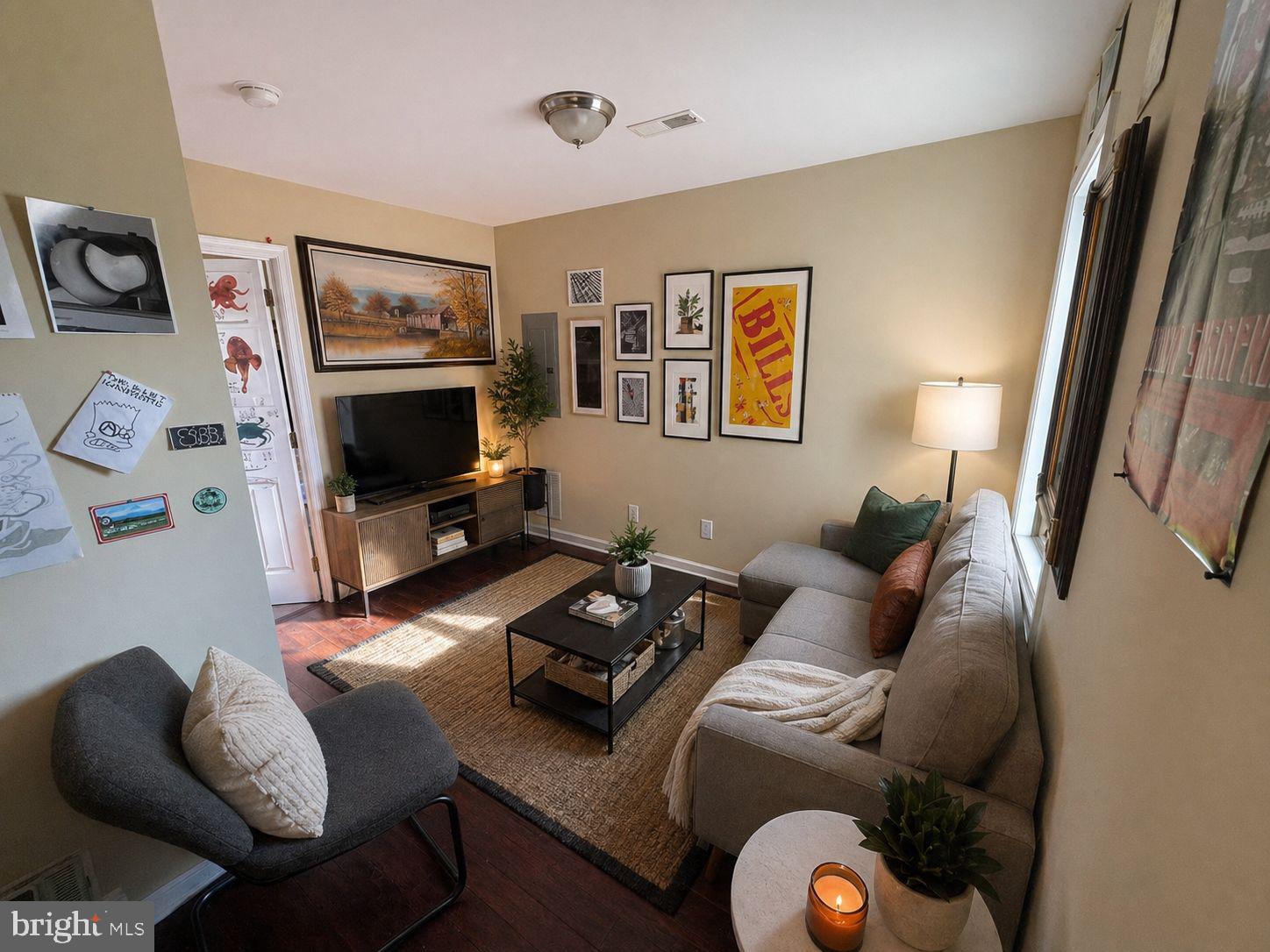 1618 Page Street, Unit A Philadelphia, PA 19121 - Photo 13 of 21 a living room with furniture and a flat screen tv