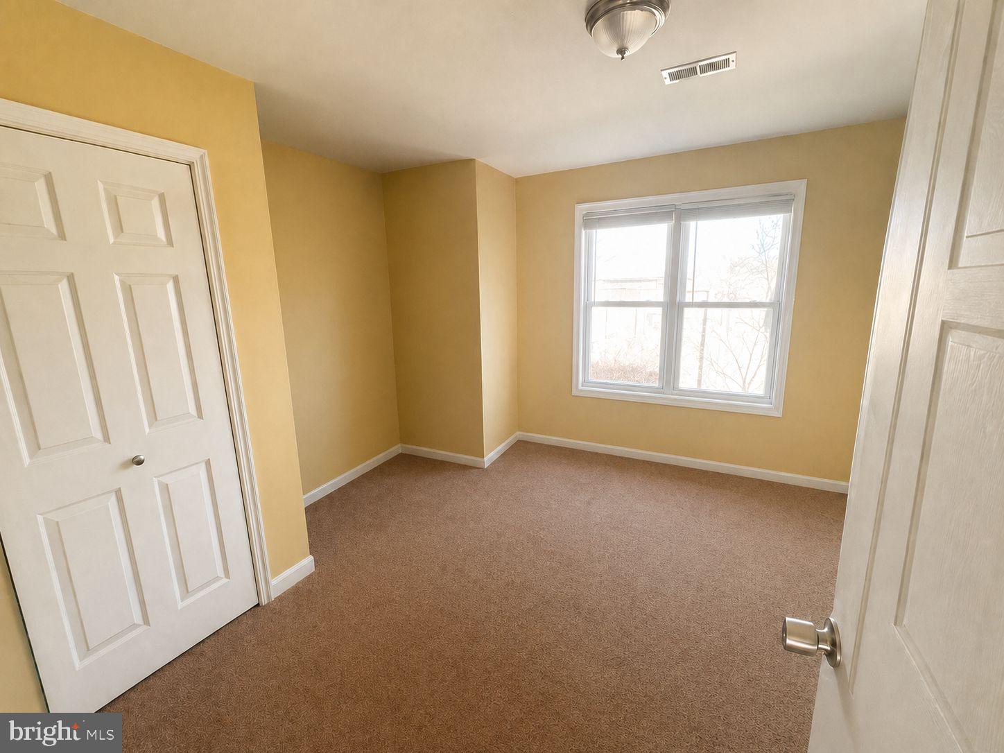 1618 Page Street, Unit A Philadelphia, PA 19121 - Photo 16 of 21 an empty room with windows