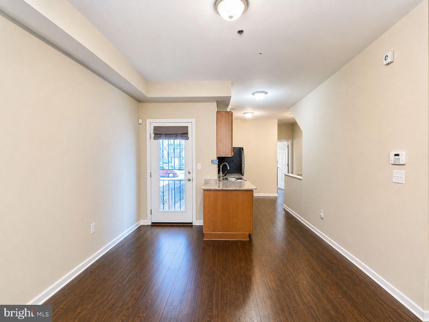 1618 Page Street, Unit A Philadelphia, PA 19121 - Photo 4 of 21 a view of kitchen and dining room with wooden floor