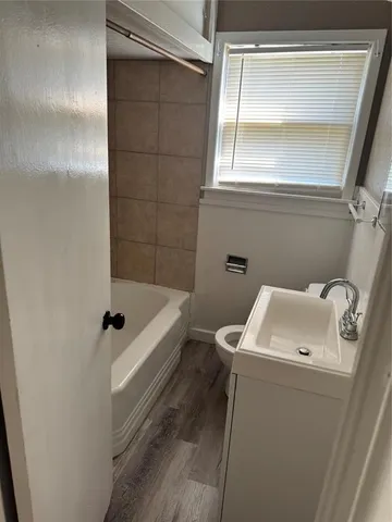 a bathroom with a sink and a bathtub
