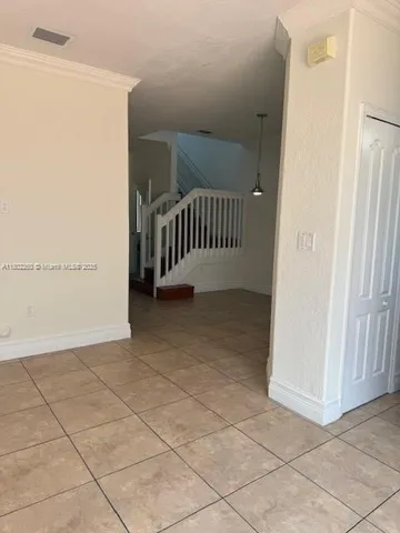 a view of a hallway with a door