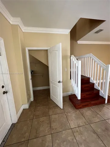 a view of entryway with stairs