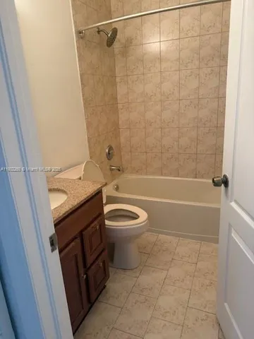 a bathroom with a sink a toilet and a shower