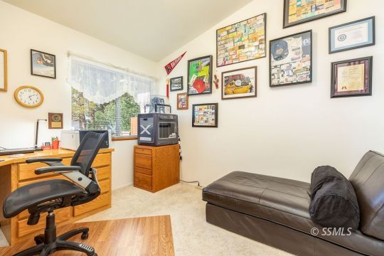 1217 Flora Way Ridgecrest, CA 93555 - Photo 27 of 39 a living room with furniture and a window