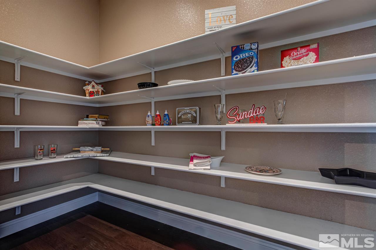10060 Gold Cup Lane Reno, NV 89521 - Photo 11 of 25 a view of storage and utility room with racks on the wall