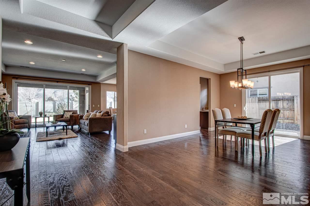 10060 Gold Cup Lane Reno, NV 89521 - Photo 2 of 25 a view of a dining room with furniture window and wooden floor