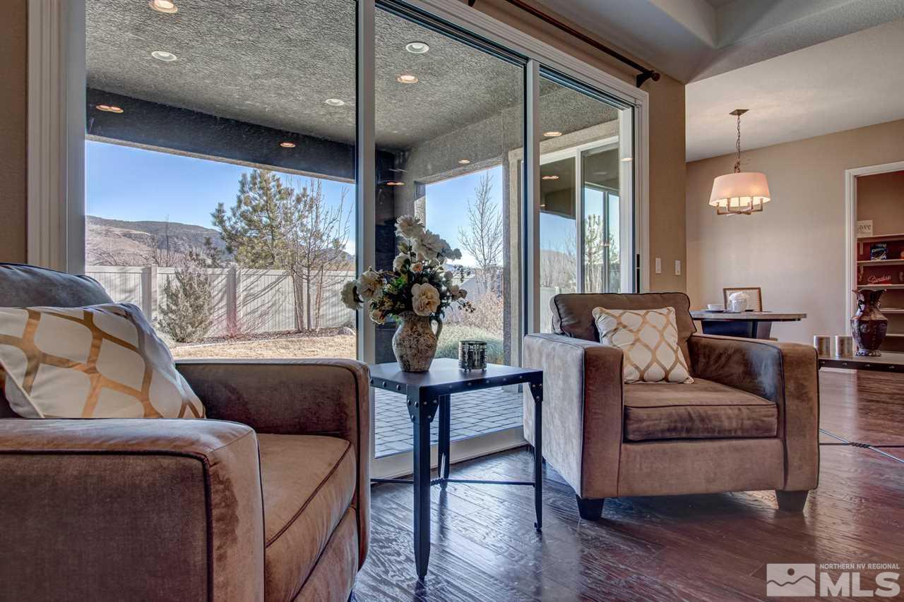 10060 Gold Cup Lane Reno, NV 89521 - Photo 7 of 25 a living room with furniture and a large window