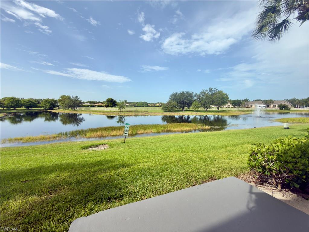 13615 Eagle Ridge Drive, Unit 1614 Fort Myers, FL 33912 - Photo 21 of 34 Pickleball courts featuring blue playing areas and green surrounds