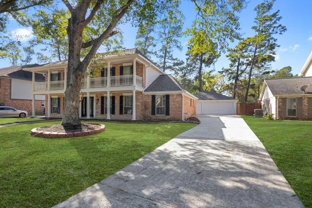 a front view of a house with a yard and porch