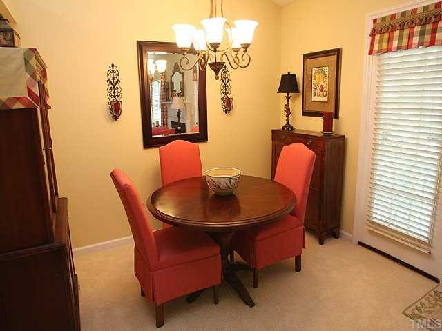 A separate formal dining area opens to the living room and convenient to the screen porch.