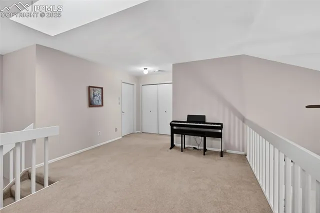 a spacious bedroom with a bed and window
