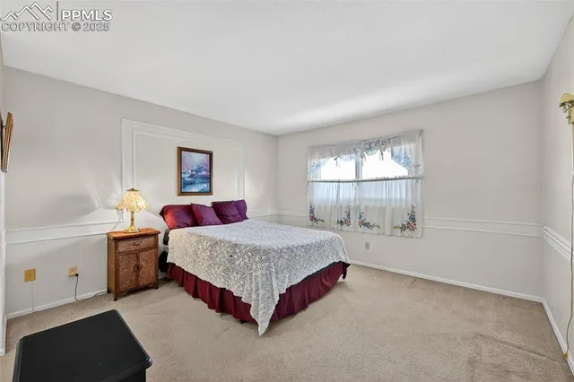 a bedroom with a bed and a fireplace