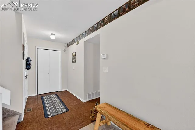 a view of bedroom with furniture and wooden floor
