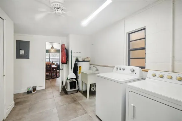 a utility room with dryer and washer