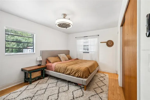 a bedroom with a bed and a window