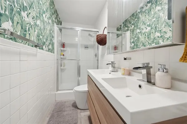 a bathroom with a sink and mirror