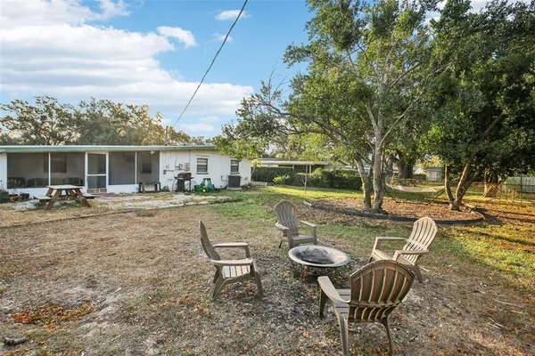 a view of swimming pool with outdoor seating