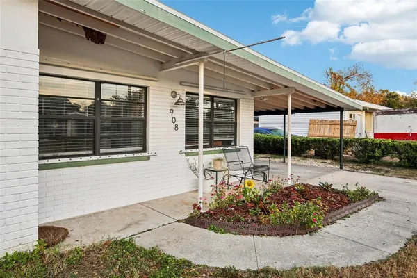 a view of a house with sitting area and roof