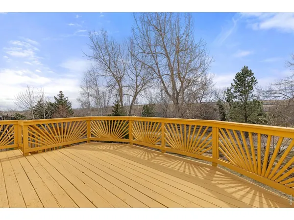 a view of balcony with wooden floor