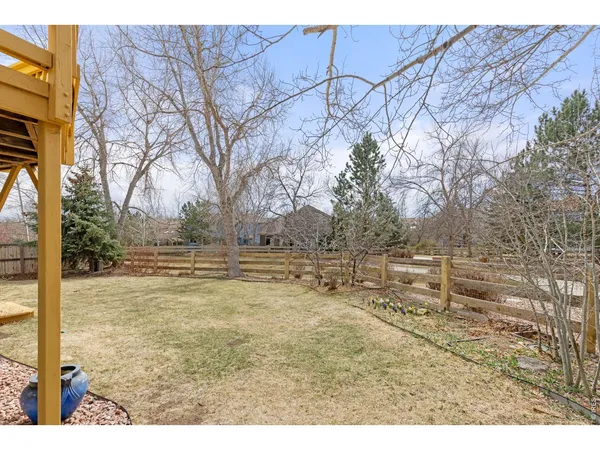 a view of open space with wooden fence