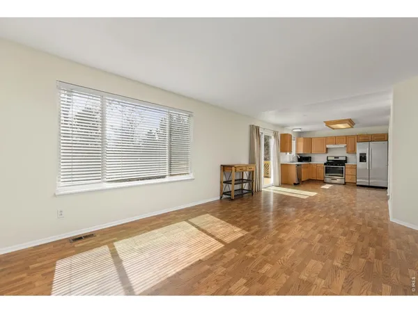 a view of a livingroom with furniture and windows