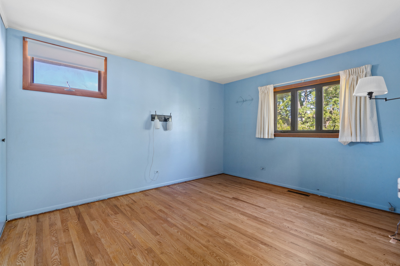 244 Thomas Street Park Forest, IL 60466 - Photo 11 of 30 a view of an empty room with wooden floor and a window